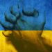 Рукопожатие на фоне флага Украины